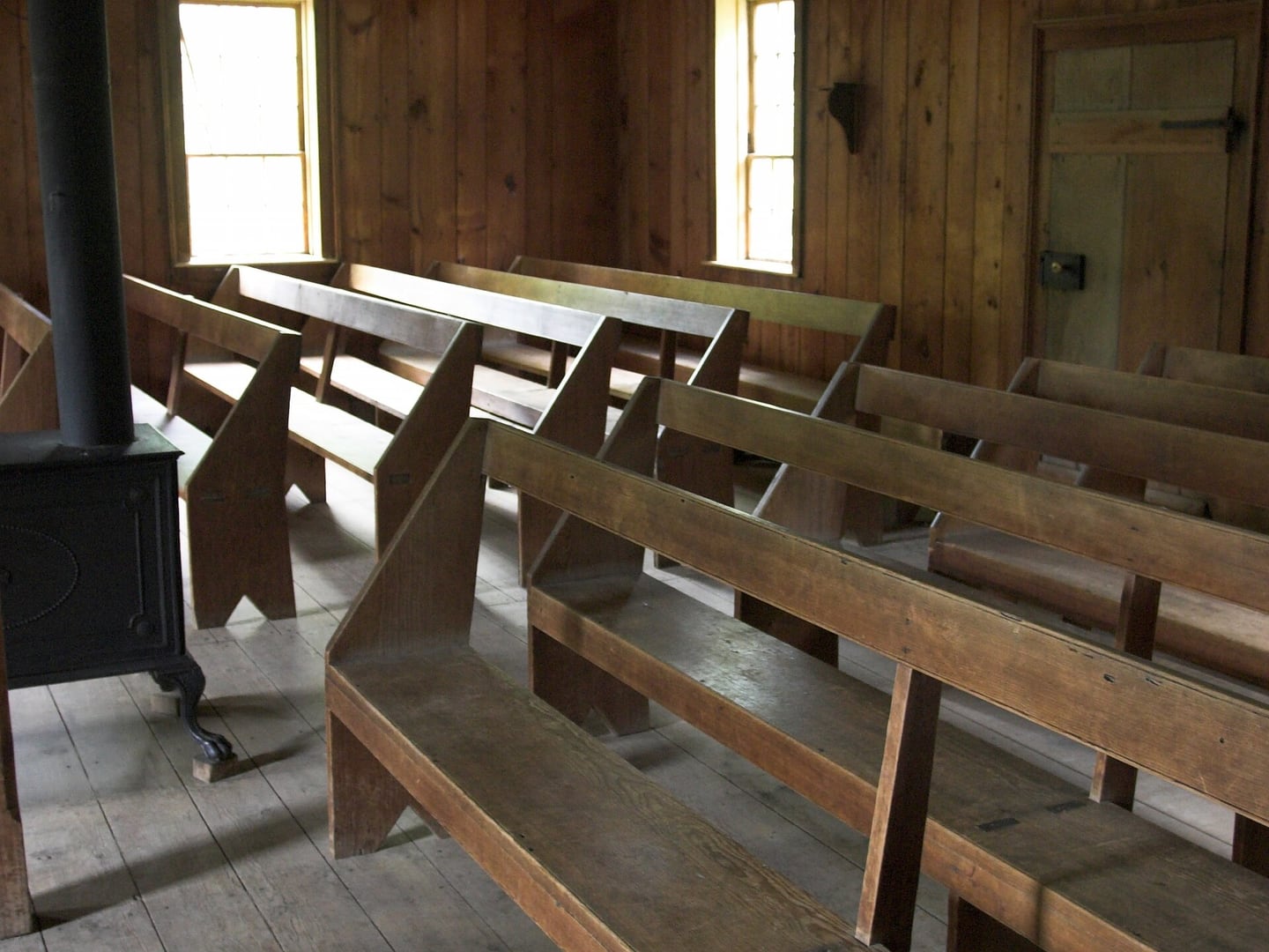 Wooden church pews in a historic Canadian church interior